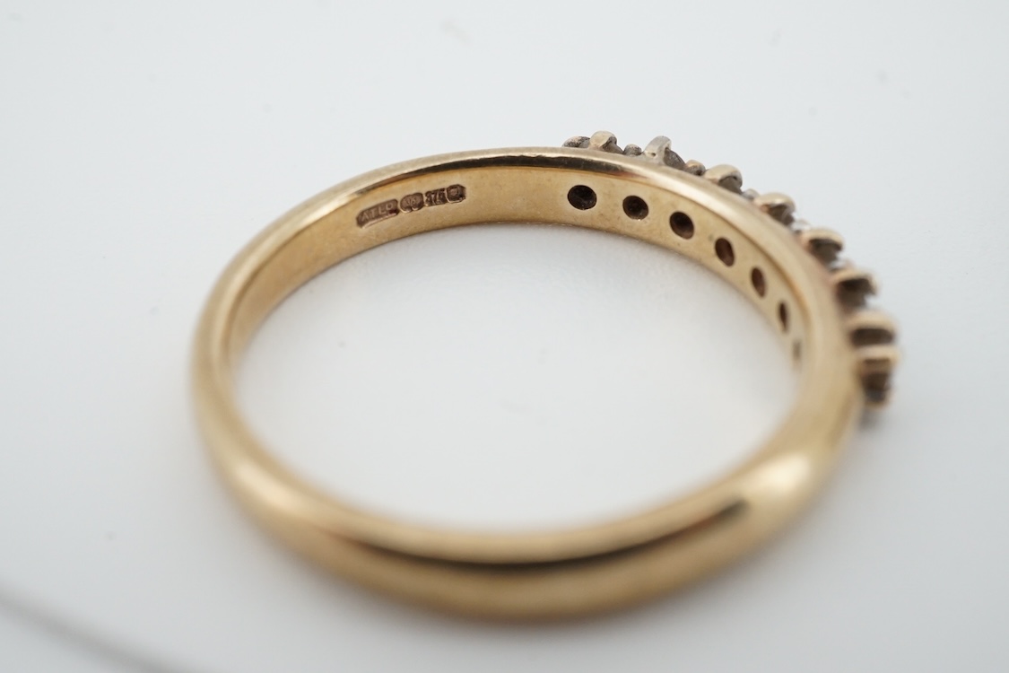 A 9ct gold and solitaire diamond set ring, size O/P and a 9ct gold an seven stone diamond set half hoop ring, size O, gross weight 4 grams.